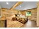 Bedroom with wood paneled walls and ceiling, plus natural light at 10436 Jeanette Ct, Morrison, CO 80465