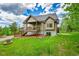 Charming house with lovely lawn space and deck with access from the first floor at 10436 Jeanette Ct, Morrison, CO 80465