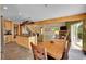 An open floor plan with combined kitchen, dining, and living room areas with hardwood flooring at 10436 Jeanette Ct, Morrison, CO 80465