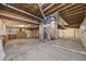 Unfinished basement with exposed ductwork and foundation walls; great potential for customization at 5796 E 129Th Pl, Thornton, CO 80602