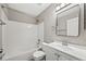 Bathroom with shower-tub combo, light vanity, and modern mirror at 5796 E 129Th Pl, Thornton, CO 80602
