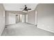 Neutral-colored bedroom with plush carpeting and a ceiling fan at 5796 E 129Th Pl, Thornton, CO 80602