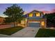 Charming two-story home boasts a well-maintained lawn and an attached two-car garage at 5796 E 129Th Pl, Thornton, CO 80602