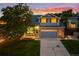 Charming two-story home boasts a well-maintained lawn and an attached two-car garage at 5796 E 129Th Pl, Thornton, CO 80602