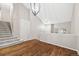 Inviting foyer with hardwood floors, a staircase, and a bright, airy feel at 5796 E 129Th Pl, Thornton, CO 80602
