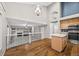 Bright, open kitchen with an island and view of the living room with a fireplace at 5796 E 129Th Pl, Thornton, CO 80602