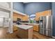 Modern kitchen featuring stainless steel appliances, ample cabinet space, and a center island at 5796 E 129Th Pl, Thornton, CO 80602