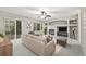 Comfortable living room featuring a fireplace, built-in shelving, and a sliding glass door to a deck at 5796 E 129Th Pl, Thornton, CO 80602