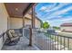Covered back porch offers an outdoor seating area with a nice view and a nearby hot tub at 11624 Dunrich Rd, Parker, CO 80138