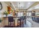 Stylish bar area with countertop seating, wooden cabinetry, and convenient access to the patio at 11624 Dunrich Rd, Parker, CO 80138