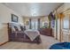 Comfortable bedroom with natural light, ample closet space, and neutral decor creating a relaxing atmosphere at 11624 Dunrich Rd, Parker, CO 80138