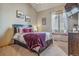 Comfortable bedroom with cozy bedding, natural light, and tasteful decor for a relaxing atmosphere at 11624 Dunrich Rd, Parker, CO 80138