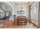 Inviting dining room with wood floors, natural light, and an open view to the living area at 11624 Dunrich Rd, Parker, CO 80138