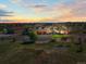 Stunning home with an attached garage, a barn, and a circular driveway on a large lot surrounded by green lawns at 11624 Dunrich Rd, Parker, CO 80138
