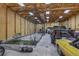 Spacious garage interior with high ceilings and ample storage, featuring a batting cage at 11624 Dunrich Rd, Parker, CO 80138