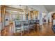 Well-lit kitchen with recessed lighting, hard wood floors, modern appliances, a dining area, and an island at 11624 Dunrich Rd, Parker, CO 80138