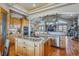 Open-concept kitchen with island cooktop and stainless steel appliances at 11624 Dunrich Rd, Parker, CO 80138