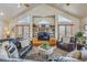 Cozy living room with cathedral ceilings, lots of natural light, hardwood floors, and comfortable furniture at 11624 Dunrich Rd, Parker, CO 80138