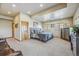 Inviting primary bedroom with a comfortable bed, soft carpet, and natural light from shuttered windows at 11624 Dunrich Rd, Parker, CO 80138