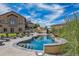 Beautiful outdoor pool with lounge chairs, manicured landscaping, and a view of the home at 11624 Dunrich Rd, Parker, CO 80138