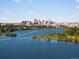 Breathtaking skyline view over the lake with lush green space in the foreground at 1612 Wolff St, Denver, CO 80204