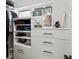 Walk-in closet featuring shelving and drawers at 1612 Wolff St, Denver, CO 80204