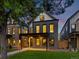 Charming modern home boasts dark brick, an inviting entrance, and professionally landscaped yard at 1612 Wolff St, Denver, CO 80204