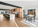 Spacious, open-concept kitchen and dining area with island seating and modern appliances at 1612 Wolff St, Denver, CO 80204