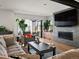 Living room featuring modern fireplace and large sliding glass door at 1612 Wolff St, Denver, CO 80204