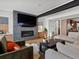 Inviting living room featuring a brick fireplace and flat screen TV at 1612 Wolff St, Denver, CO 80204