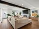 Bright, open living room featuring a comfortable sofa, fireplace, and a TV at 1612 Wolff St, Denver, CO 80204