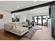 Spacious living room with brick fireplace and large sofa at 1612 Wolff St, Denver, CO 80204