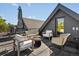 Stylish rooftop deck with modern seating and umbrella, perfect for outdoor relaxation and entertaining at 1612 Wolff St, Denver, CO 80204