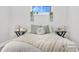 Bright bedroom with neutral decor and a comfortable bed at 9300 Grove St, Westminster, CO 80031
