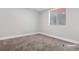 Simple bedroom with a window and carpet at 9300 Grove St, Westminster, CO 80031