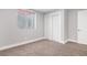 Charming bedroom with closet and window at 9300 Grove St, Westminster, CO 80031