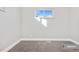 Small bedroom with neutral walls and carpeting at 9300 Grove St, Westminster, CO 80031