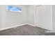 Simple bedroom with neutral walls and carpeting at 9300 Grove St, Westminster, CO 80031