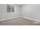 Well-lit bedroom with neutral walls and carpet at 9300 Grove St, Westminster, CO 80031