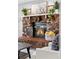 Stone fireplace with modern mantel and warm fire at 9300 Grove St, Westminster, CO 80031