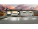 Charming single-story home with unique rock accent and covered front porch at sunset at 9300 Grove St, Westminster, CO 80031