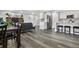 Open floor plan with stone fireplace, kitchen island, and gray sofa at 9300 Grove St, Westminster, CO 80031