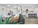 Open concept living room and kitchen with gray sofa at 9300 Grove St, Westminster, CO 80031