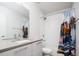 Modern bathroom with white tiled shower, and a mountain-themed shower curtain at 5630 W 11Th Pl, Lakewood, CO 80214