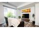 Inviting living room with comfortable sofa, entertainment center, area rug, and sliding glass doors to a patio at 5630 W 11Th Pl, Lakewood, CO 80214