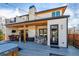 Expansive backyard with hot tub, outdoor dining, and fireplace for luxurious outdoor living at 2600 S Adams St, Denver, CO 80210