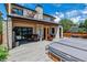 Spacious backyard with a hot tub, outdoor seating, and stylish deck, ideal for entertaining at 2600 S Adams St, Denver, CO 80210