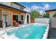 Backyard oasis with a hot tub, outdoor seating, and a patio area perfect for entertaining at 2600 S Adams St, Denver, CO 80210