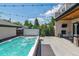 Outdoor living space with a hot tub, fireplace, and cozy seating, ideal for relaxation at 2600 S Adams St, Denver, CO 80210