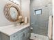 Elegant bathroom boasts sleek vanity, glass-enclosed shower, and spa-like ambiance at 2600 S Adams St, Denver, CO 80210